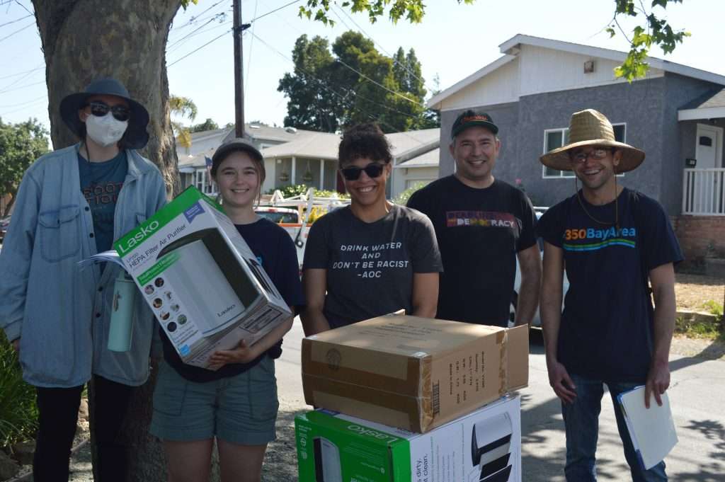 Volunteers gathered to distribute 300 Lasko air purifiers to the Martinez community.